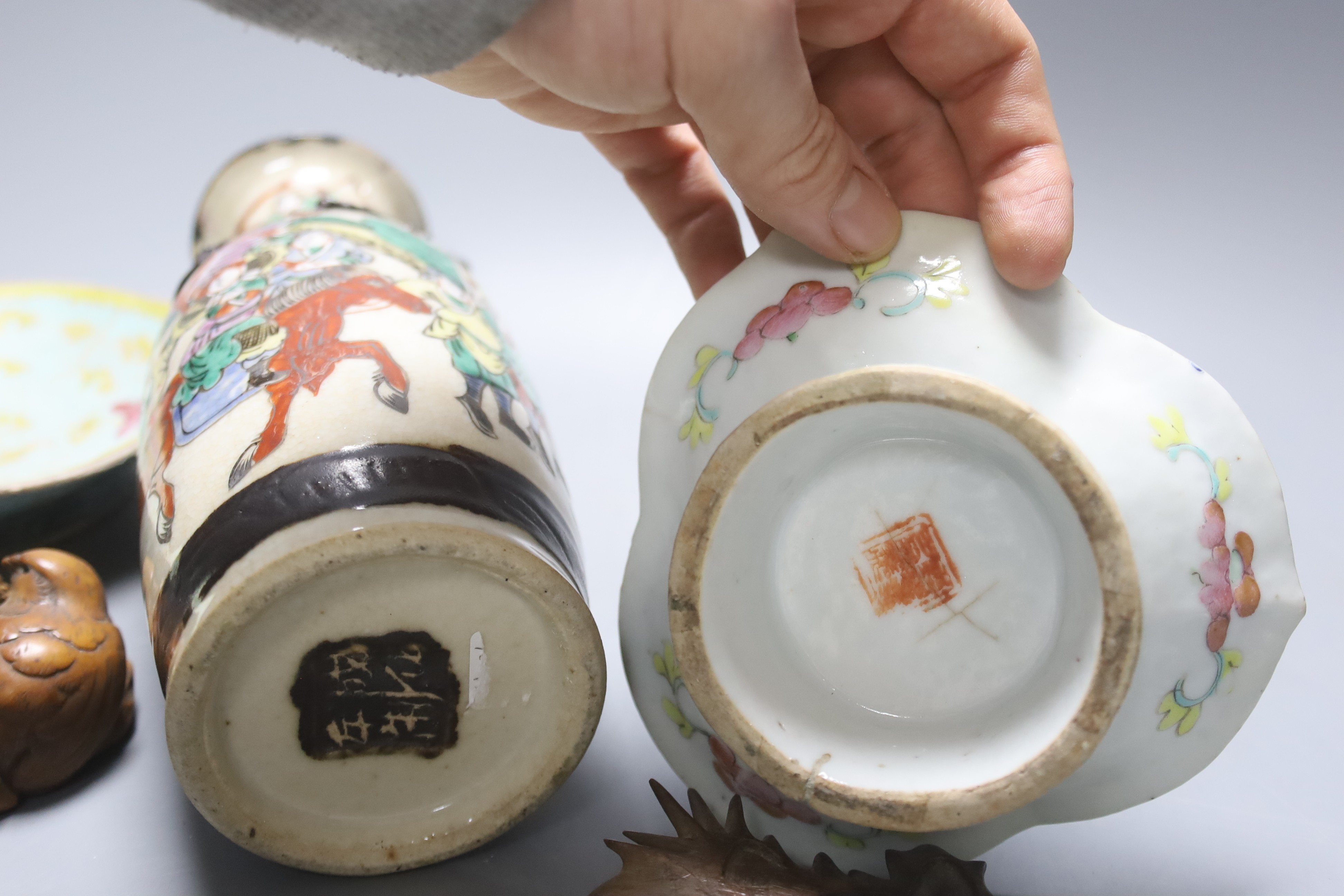 A group of 19th century Chinese porcelain dishes and a vase, and a Japanese ‘bird’ carving etc.